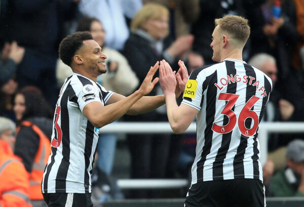 Newcastle United's English midfielder Jacob Murphy (L) celebrates scoring the opening goal with Newcastle United's English midfielder Sean Longstaff during the English Premier League football match between Newcastle United and Tottenham Hotspur at St James' Park in Newcastle-upon-Tyne, north east England on April 23, 2023. (Photo by Lindsey Parnaby / AFP) / RESTRICTED TO EDITORIAL USE. No use with unauthorized audio, video, data, fixture lists, club/league logos or 'live' services. Online in-match use limited to 120 images. An additional 40 images may be used in extra time. No video emulation. Social media in-match use limited to 120 images. An additional 40 images may be used in extra time. No use in betting publications, games or single club/league/player publications. / (Photo by LINDSEY PARNABY/AFP via Getty Images)