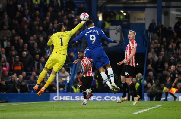 LONDON, ENGLAND - APRIL 26: David Raya of Brentford is beaten to the ball as Pierre-Emerick Aubameyang of Chelsea has a headed shot which goes over the crossbar during the Premier League match between Chelsea FC and Brentford FC at Stamford Bridge on April 26, 2023 in London, England. 
