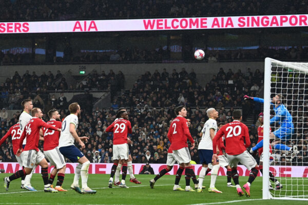 Manchester United's Spanish goalkeeper David de Gea (R) punches the ball clear during the English Premier League football match between Tottenham Hotspur and Manchester United at Tottenham Hotspur Stadium in London, on April 27, 2023. (Photo by Glyn KIRK / AFP) / RESTRICTED TO EDITORIAL USE. No use with unauthorized audio, video, data, fixture lists, club/league logos or 'live' services. Online in-match use limited to 120 images. An additional 40 images may be used in extra time. No video emulation. Social media in-match use limited to 120 images. An additional 40 images may be used in extra time. No use in betting publications, games or single club/league/player publications. / 