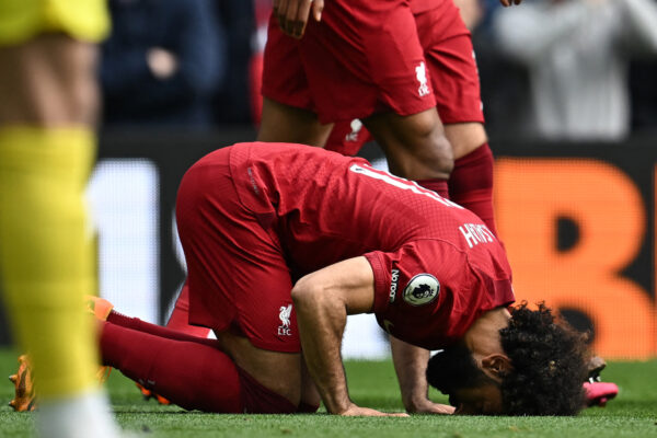 Liverpool's Egyptian striker Mohamed Salah celebrates after scoring their third goal from the penalty spot during the English Premier League football match between Liverpool and Tottenham Hotspur at Anfield in Liverpool, north west England on April 30, 2023. (Photo by Paul ELLIS / AFP) / RESTRICTED TO EDITORIAL USE. No use with unauthorized audio, video, data, fixture lists, club/league logos or 'live' services. Online in-match use limited to 120 images. An additional 40 images may be used in extra time. No video emulation. Social media in-match use limited to 120 images. An additional 40 images may be used in extra time. No use in betting publications, games or single club/league/player publications. / (Photo by PAUL ELLIS/AFP via Getty Images)