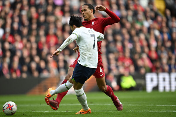 Tottenham Hotspur's South Korean striker Son Heung-Min shoots to score their second goal during the English Premier League football match between Liverpool and Tottenham Hotspur at Anfield in Liverpool, north west England on April 30, 2023. (Photo by Paul ELLIS / AFP) / RESTRICTED TO EDITORIAL USE. No use with unauthorized audio, video, data, fixture lists, club/league logos or 'live' services. Online in-match use limited to 120 images. An additional 40 images may be used in extra time. No video emulation. Social media in-match use limited to 120 images. An additional 40 images may be used in extra time. No use in betting publications, games or single club/league/player publications. / 