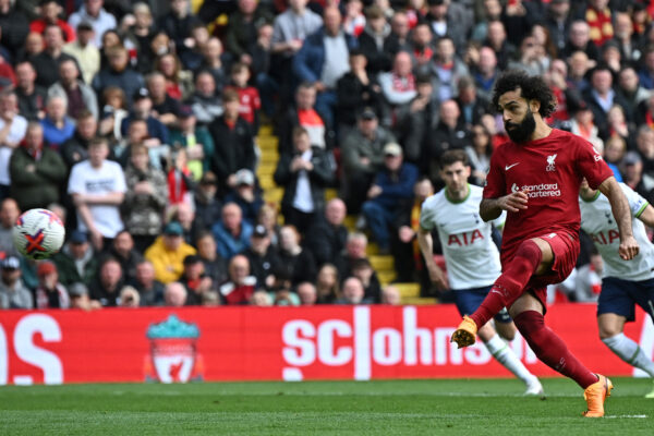 Liverpool's Egyptian striker Mohamed Salah scores their third goal from the penalty spot during the English Premier League football match between Liverpool and Tottenham Hotspur at Anfield in Liverpool, north west England on April 30, 2023. (Photo by Paul ELLIS / AFP) / RESTRICTED TO EDITORIAL USE. No use with unauthorized audio, video, data, fixture lists, club/league logos or 'live' services. Online in-match use limited to 120 images. An additional 40 images may be used in extra time. No video emulation. Social media in-match use limited to 120 images. An additional 40 images may be used in extra time. No use in betting publications, games or single club/league/player publications. / 