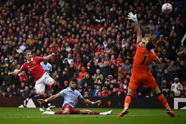 Aston Villa's Argentinian goalkeeper Emiliano Martinez (R) stops the ball shot by Manchester United's Austrian midfielder Marcel Sabitzer (L) during the English Premier League football match between Manchester United and Aston Villa at Old Trafford in Manchester, north west England, on April 30, 2023. (Photo by Oli SCARFF / AFP) / RESTRICTED TO EDITORIAL USE. No use with unauthorized audio, video, data, fixture lists, club/league logos or 'live' services. Online in-match use limited to 120 images. An additional 40 images may be used in extra time. No video emulation. Social media in-match use limited to 120 images. An additional 40 images may be used in extra time. No use in betting publications, games or single club/league/player publications. / 
