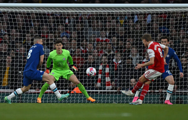 Chelsea's Spanish goalkeeper Kepa Arrizabalaga (2L) watches the ball as Arsenal's Norwegian midfielder Martin Odegaard shoots to score the opening goal during the English Premier League football match between Arsenal and Chelsea at the Emirates Stadium, in London, on May 2, 2023. (Photo by Ben Stansall / AFP) / RESTRICTED TO EDITORIAL USE. No use with unauthorized audio, video, data, fixture lists, club/league logos or 'live' services. Online in-match use limited to 120 images. An additional 40 images may be used in extra time. No video emulation. Social media in-match use limited to 120 images. An additional 40 images may be used in extra time. No use in betting publications, games or single club/league/player publications. / 