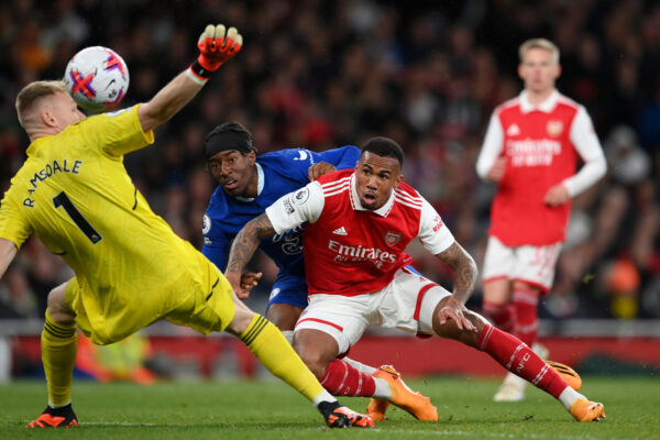 LONDON, ENGLAND - MAY 02: Noni Madueke of Chelsea scores the team's first goal whilst under pressure from Gabriel of Arsenal as Aaron Ramsdale fails to make save during the Premier League match between Arsenal FC and Chelsea FC at Emirates Stadium on May 02, 2023 in London, England. 
