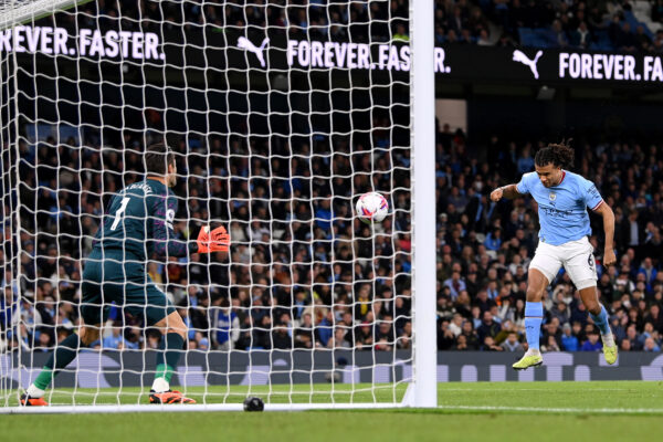MANCHESTER, ENGLAND - MAY 03: Nathan Ake of Manchester City scores the team's first goal during the Premier League match between Manchester City and West Ham United at Etihad Stadium on May 03, 2023 in Manchester, England. 