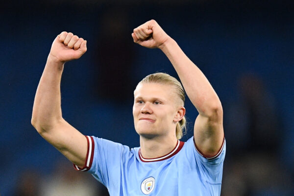 Manchester City's Norwegian striker Erling Haaland celebrates the title of "most goal in a single season" at the end of the English Premier League football match between Manchester City and West Ham at the Etihad Stadium in Manchester, north west England, on May 3, 2023. - Manchester City wins 3 - 0 against West Ham. (Photo by Oli SCARFF / AFP) / RESTRICTED TO EDITORIAL USE. No use with unauthorized audio, video, data, fixture lists, club/league logos or 'live' services. Online in-match use limited to 120 images. An additional 40 images may be used in extra time. No video emulation. Social media in-match use limited to 120 images. An additional 40 images may be used in extra time. No use in betting publications, games or single club/league/player publications. / 