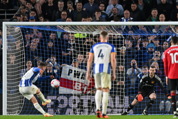 Brighton's Argentinian midfielder Alexis Mac Allister (L) scores their goal from the penalty spot during the English Premier League football match between Brighton and Hove Albion and Manchester United at the American Express Community Stadium in Brighton, southern England on May 4, 2023. - Brighton won the game 1-0. (Photo by Glyn KIRK / AFP) / RESTRICTED TO EDITORIAL USE. No use with unauthorized audio, video, data, fixture lists, club/league logos or 'live' services. Online in-match use limited to 120 images. An additional 40 images may be used in extra time. No video emulation. Social media in-match use limited to 120 images. An additional 40 images may be used in extra time. No use in betting publications, games or single club/league/player publications. / 