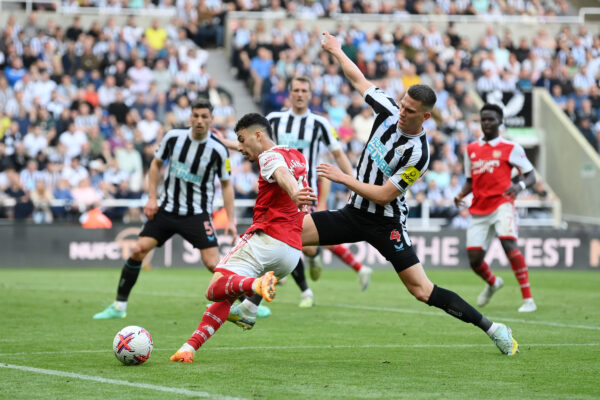 NEWCASTLE UPON TYNE, ENGLAND - MAY 07: Gabriel Martinelli of Arsenal has a shot which is deflected by Fabian Schaer of Newcastle United leading to an own goal, the second goal for Arsenal, during the Premier League match between Newcastle United and Arsenal FC at St. James Park on May 07, 2023 in Newcastle upon Tyne, England. 