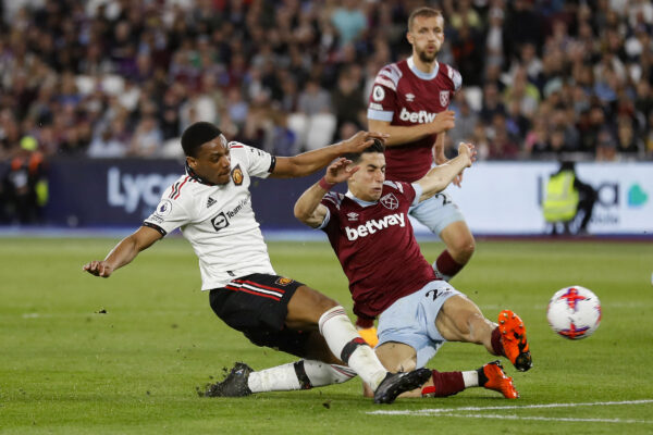 Manchester United's French striker Anthony Martial (L) fights for the ball with West Ham United's Moroccan defender Nayef Aguerd (C) during the English Premier League football match between West Ham United and Manchester United at the London Stadium, in London on May 7, 2023. (Photo by Ian Kington / AFP) / RESTRICTED TO EDITORIAL USE. No use with unauthorized audio, video, data, fixture lists, club/league logos or 'live' services. Online in-match use limited to 120 images. An additional 40 images may be used in extra time. No video emulation. Social media in-match use limited to 120 images. An additional 40 images may be used in extra time. No use in betting publications, games or single club/league/player publications. / 