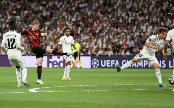 MADRID, SPAIN - MAY 09: Kevin De Bruyne of Manchester City scores the team's first goal during the UEFA Champions League semi-final first leg match between Real Madrid and Manchester City FC at Estadio Santiago Bernabeu on May 09, 2023 in Madrid, Spain. 