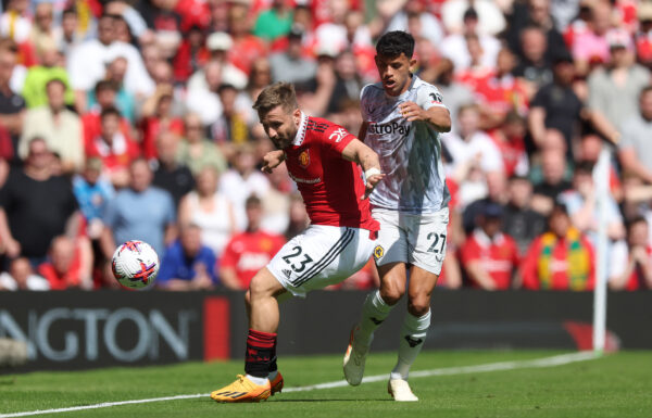 MANCHESTER, ENGLAND - MAY 13: Luke Shaw of Manchester United controls the ball whilst under pressure from Matheus Nunes of Wolverhampton Wanderers during the Premier League match between Manchester United and Wolverhampton Wanderers at Old Trafford on May 13, 2023 in Manchester, England. 