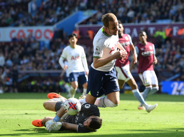 BIRMINGHAM, ENGLAND - MAY 13: Harry Kane of Tottenham Hotspur is challenged by Emiliano Martinez of Aston Villa which leads to a Tottenham Hotspur penalty during the Premier League match between Aston Villa and Tottenham Hotspur at Villa Park on May 13, 2023 in Birmingham, England. 