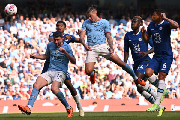 Manchester City's English midfielder Kalvin Phillips (C) headers at goal but fails to score during the English Premier League football match between Manchester City and Chelsea at the Etihad Stadium in Manchester, north west England, on May 21, 2023. (Photo by Oli SCARFF / AFP) / RESTRICTED TO EDITORIAL USE. No use with unauthorized audio, video, data, fixture lists, club/league logos or 'live' services. Online in-match use limited to 120 images. An additional 40 images may be used in extra time. No video emulation. Social media in-match use limited to 120 images. An additional 40 images may be used in extra time. No use in betting publications, games or single club/league/player publications. / (Photo by OLI SCARFF/AFP via Getty Images)