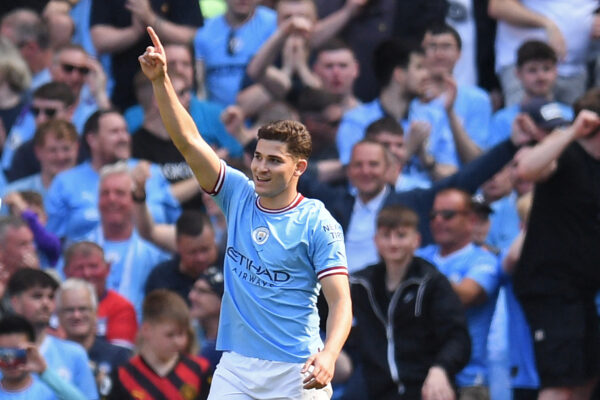Manchester City's Argentinian striker Julian Alvarez celebrates scoring the opening goal during the English Premier League football match between Manchester City and Chelsea at the Etihad Stadium in Manchester, north west England, on May 21, 2023. (Photo by Oli SCARFF / AFP) / RESTRICTED TO EDITORIAL USE. No use with unauthorized audio, video, data, fixture lists, club/league logos or 'live' services. Online in-match use limited to 120 images. An additional 40 images may be used in extra time. No video emulation. Social media in-match use limited to 120 images. An additional 40 images may be used in extra time. No use in betting publications, games or single club/league/player publications. / 