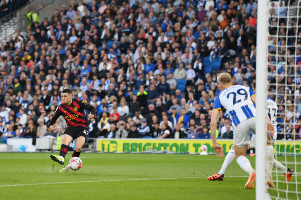 BRIGHTON, ENGLAND - MAY 24: Phil Foden of Manchester City scores the team's first goal during the Premier League match between Brighton & Hove Albion and Manchester City at American Express Community Stadium on May 24, 2023 in Brighton, England. 