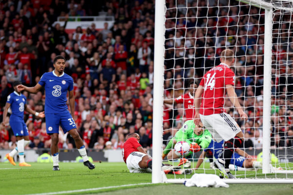 MANCHESTER, ENGLAND - MAY 25: Kepa Arrizabalaga of Chelsea makes a save whilst under pressure from Anthony Martial and Christian Eriksen of Manchester United during the Premier League match between Manchester United and Chelsea FC at Old Trafford on May 25, 2023 in Manchester, England. 