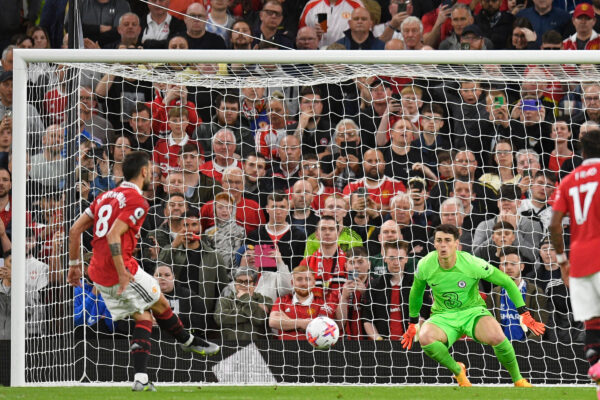 Manchester United's Portuguese midfielder Bruno Fernandes (L) scores their third goal from the penalty spot during the English Premier League football match between Manchester United and Chelsea at Old Trafford in Manchester, north west England, on May 25, 2023. (Photo by Oli SCARFF / AFP) / RESTRICTED TO EDITORIAL USE. No use with unauthorized audio, video, data, fixture lists, club/league logos or 'live' services. Online in-match use limited to 120 images. An additional 40 images may be used in extra time. No video emulation. Social media in-match use limited to 120 images. An additional 40 images may be used in extra time. No use in betting publications, games or single club/league/player publications. / 