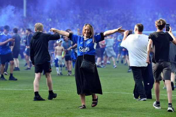 Everton supporters invade the pitch to celebrate at the end of the English Premier League football match between Everton and Bournemouth at Goodison Park in Liverpool, northwest England, on May 28, 2023. (Photo by PETER POWELL / AFP) / RESTRICTED TO EDITORIAL USE. No use with unauthorized audio, video, data, fixture lists, club/league logos or 'live' services. Online in-match use limited to 120 images. An additional 40 images may be used in extra time. No video emulation. Social media in-match use limited to 120 images. An additional 40 images may be used in extra time. No use in betting publications, games or single club/league/player publications. / 