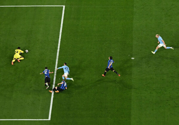 Inter Milan's Cameroonian goalkeeper #24 Andre Onana (L) saves a shot by Manchester City's English midfielder #47 Phil Foden (C) during the UEFA Champions League final football match between Inter Milan and Manchester City at the Ataturk Olympic Stadium in Istanbul, on June 10, 2023. (Photo by Franck FIFE / AFP) 