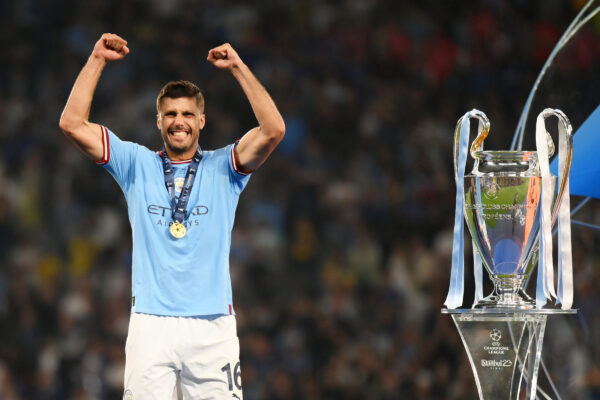 ISTANBUL, TURKEY - JUNE 10: Rodri of Manchester City celebrates while wearing his winners medal next to the UEFA Champions League trophy after the team's victory in the UEFA Champions League 2022/23 final match between FC Internazionale and Manchester City FC at Atatuerk Olympic Stadium on June 10, 2023 in Istanbul, Turkey. 