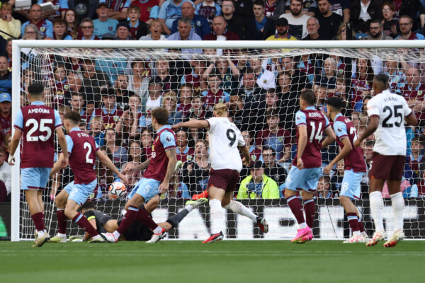 Manchester City's Norwegian striker #09 Erling Haaland shoots and scores her team first goal during the English Premier League football match between Burnley and Manchester City at Turf Moor in Burnley, north-west England on August 11, 2023. (Photo by Darren Staples / AFP) / RESTRICTED TO EDITORIAL USE. No use with unauthorized audio, video, data, fixture lists, club/league logos or 'live' services. Online in-match use limited to 120 images. An additional 40 images may be used in extra time. No video emulation. Social media in-match use limited to 120 images. An additional 40 images may be used in extra time. No use in betting publications, games or single club/league/player publications. / 