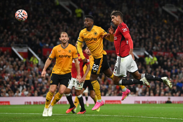 MANCHESTER, ENGLAND - AUGUST 14: Raphael Varane of Manchester United scores the team's first goal during the Premier League match between Manchester United and Wolverhampton Wanderers at Old Trafford on August 14, 2023 in Manchester, England. 