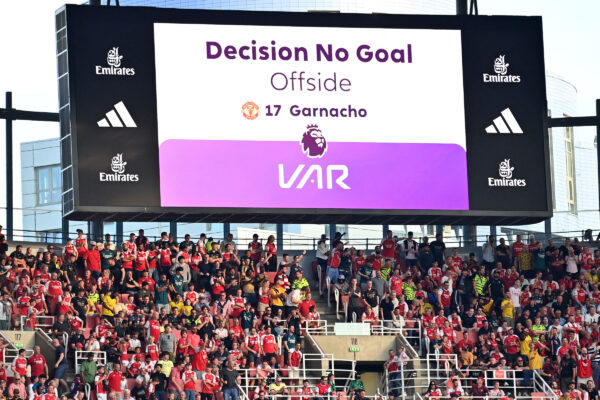 The big screen displays the decision that after a VAR (Video Assistant Referee) review a goal from Manchester United's Argentinian midfielder #49 Alejandro Garnacho is disallowed for offside during the English Premier League football match between Arsenal and Manchester United at the Emirates Stadium in London on September 3, 2023. (Photo by Glyn KIRK / AFP) / RESTRICTED TO EDITORIAL USE. No use with unauthorized audio, video, data, fixture lists, club/league logos or 'live' services. Online in-match use limited to 120 images. An additional 40 images may be used in extra time. No video emulation. Social media in-match use limited to 120 images. An additional 40 images may be used in extra time. No use in betting publications, games or single club/league/player publications. / 