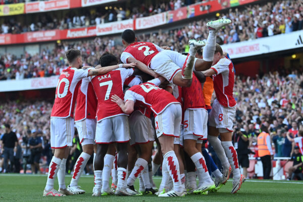 Arsenal's Brazilian striker #09 Gabriel Jesus celebrates with teammates after scoring their third goal during the English Premier League football match between Arsenal and Manchester United at the Emirates Stadium in London on September 3, 2023. Arsenal won the game 3-1. (Photo by Glyn KIRK / AFP) / RESTRICTED TO EDITORIAL USE. No use with unauthorized audio, video, data, fixture lists, club/league logos or 'live' services. Online in-match use limited to 120 images. An additional 40 images may be used in extra time. No video emulation. Social media in-match use limited to 120 images. An additional 40 images may be used in extra time. No use in betting publications, games or single club/league/player publications. / 