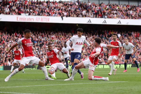 LONDON, ENGLAND - SEPTEMBER 24: Heung-Min Son of Tottenham Hotspur scores the team's first goal during the Premier League match between Arsenal FC and Tottenham Hotspur at Emirates Stadium on September 24, 2023 in London, England. 