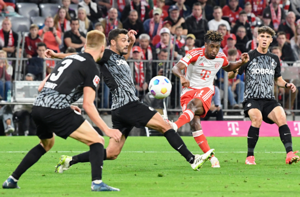 Bayern Munich's French forward #11 Kingsley Coman (2nd R) scores the 3-0 goal during the German first division Bundesliga football match between FC Bayern Munich and SC Freiburg in Munich, southern Germany on October 8, 2023. (Photo by Thomas KIENZLE / AFP) / DFL REGULATIONS PROHIBIT ANY USE OF PHOTOGRAPHS AS IMAGE SEQUENCES AND/OR QUASI-VIDEO 