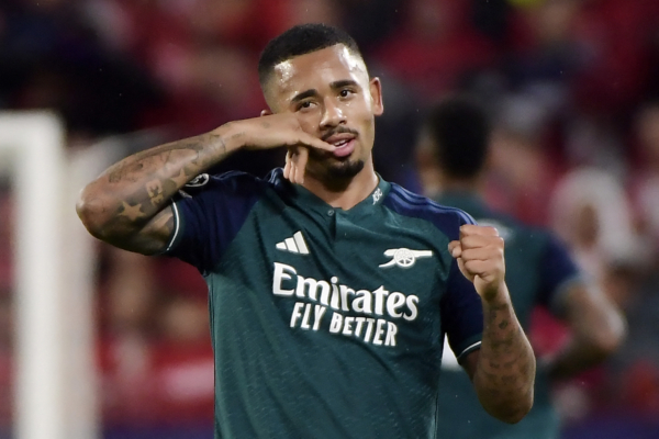 TOPSHOT - Arsenal's Brazilian forward #09 Gabriel Jesus celebrates scoring his team's second goal during the UEFA Champions League 1st round day 3 Group B football match between Sevilla FC and Arsenal at the Ramon Sanchez Pizjuan stadium in Seville on October 24, 2023. (Photo by CRISTINA QUICLER / AFP) 