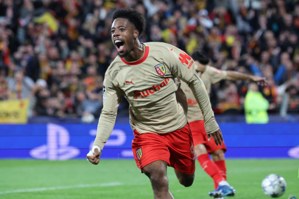 Lens' French forward #09 Elye Wahi celebrates after scoring his team's first goal during the UEFA Champions League Group B first leg football match between RC Lens and PSV Eindhoven at the Bollaert-Delelis stadium in Lens, northern France, on October 24, 2023. (Photo by FRANCOIS LO PRESTI / AFP) 