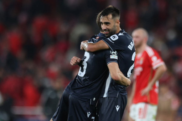 Real Sociedad's Spanish midfielder #23 Brais Mendez and Real Sociedad's Spanish defender #03 Aihen Munoz celebrate after the UEFA Champions League 1st round day 3 Group D football match between SL Benfica and Real Sociedad at the Luz stadium in Lisbon on October 24, 2023. (Photo by Patricia DE MELO MOREIRA / AFP) 