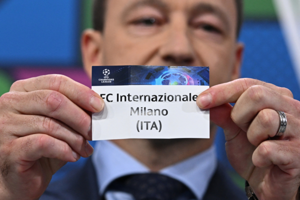 UEFA Champions League ambassador and British former football player, John Terry holds the paper slip of FC Internazionale Milano during the 2023-2024 UEFA Champions League football tournament round of 16 draw at the House of European Football in Nyon, on December 18, 2023. (Photo by Fabrice COFFRINI / AFP) 