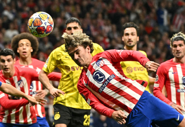 Atletico Madrid's French forward #07 Antoine Griezmann (C) heads the ball during the UEFA Champions League quarter final first leg football match between Club Atletico de Madrid and Borussia Dortmund at the Metropolitano stadium in Madrid on April 10, 2024. (Photo by JAVIER SORIANO / AFP) (Photo by JAVIER SORIANO/AFP via Getty Images)
