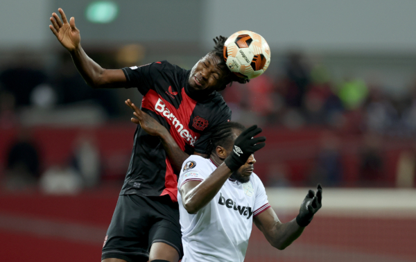LEVERKUSEN, GERMANY - APRIL 11: Edmond Tapsoba of Bayer Leverkusen goes up for a header with Michail Antonio of West Ham during the UEFA Europa League 2023/24 Quarter-Final first leg match between Bayer 04 Leverkusen and West Ham United FC at BayArena on April 11, 2024 in Leverkusen, Germany. (Photo by Lars Baron/Getty Images) (Photo by Lars Baron/Getty Images)