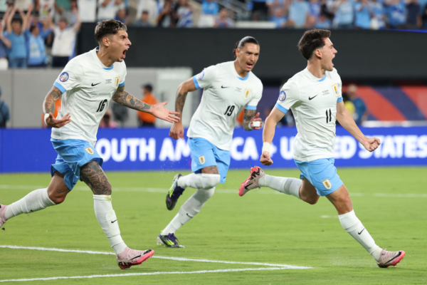 Uruguay's forward #11 Facundo Pellistri (R) celebrates with Uruguay's forward #19 Darwin Nunez and Uruguay's defender #16 Mathias Olivera after scoring his team's first goal during the Conmebol 2024 Copa America tournament group C football match between Uruguay and Bolivia at MetLife Stadium in East Rutherford, New Jersey, on June 27, 2024 (Photo by CHARLY TRIBALLEAU / AFP) 