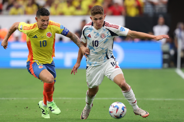 GLENDALE, ARIZONA - JUNE 28: James Rodriguez of Colombia challenges for the ball with Brandon Aguilera of Costa Rica during the CONMEBOL Copa America 2024 Group D match between Colombia and Costa Rica at State Farm Stadium on June 28, 2024 in Glendale, Arizona. 