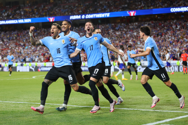 KANSAS CITY, MISSOURI - JULY 01: Mathias Olivera of Uruguay celebrates with teammates after scoring the team's first goal during the CONMEBOL Copa America 2024 Group C match between United States and Uruguay at GEHA Field at Arrowhead Stadium on July 01, 2024 in Kansas City, Missouri. 