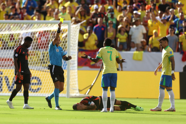SANTA CLARA, CALIFORNIA - JULY 02: Vinicius Junior of Brazil reacts after receiving a yellow card during the CONMEBOL Copa America 2024 Group D match between Brazil and Colombia at Levi's Stadium on July 02, 2024 in Santa Clara, California. 