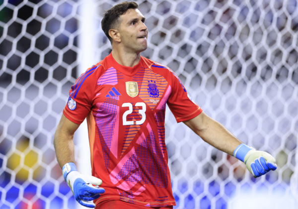 HOUSTON, TEXAS - JULY 04: Emiliano Martinez of Argentina saves the first penalty from Angel Mena of Ecuador in the penalty shoot out during the CONMEBOL Copa America 2024 quarter-final match between Argentina and Ecuador at NRG Stadium on July 04, 2024 in Houston, Texas. 