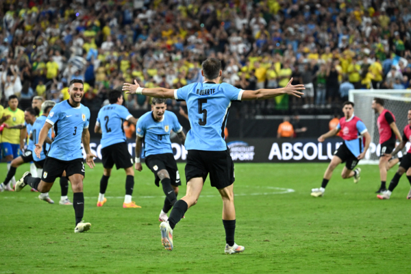 Uruguay's midfielder #05 Manuel Ugarte celebrates after scoring in a penalty shoot-out to win the Conmebol 2024 Copa America tournament quarterfinal football match between Uruguay and Brazil at Allegiant Stadium in Las Vegas, Nevada on July 6, 2024. (Photo by Robyn Beck / AFP) 