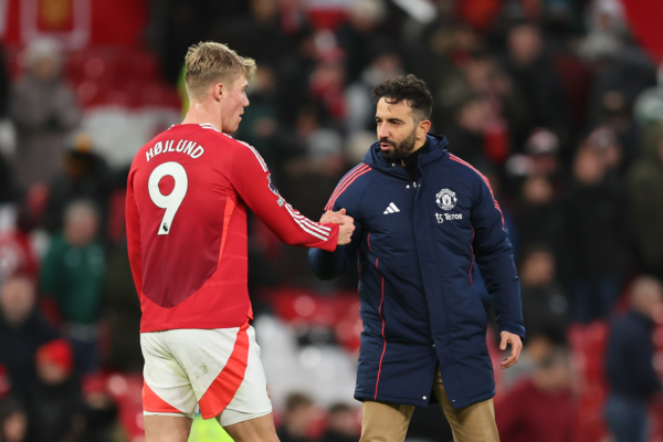 MANCHESTER, ENGLAND - DECEMBER 22: Ruben Amorim, Manager of Manchester United, interacts with Rasmus Hojlund of Manchester United after the Premier League match between Manchester United FC and AFC Bournemouth at Old Trafford on December 22, 2024 in Manchester, England. 