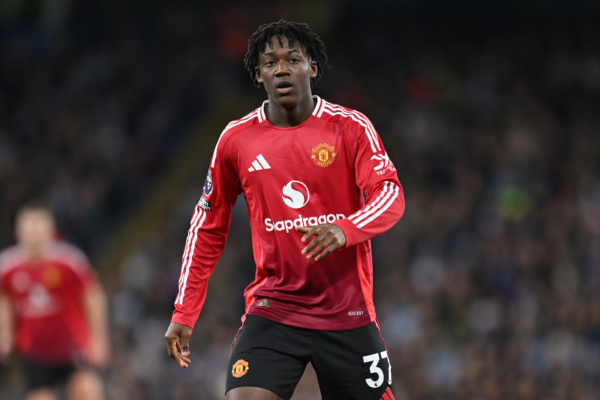 MANCHESTER, ENGLAND - DECEMBER 15: Kobbie Mainoo of Manchester United looks on during the Premier League match between Manchester City FC and Manchester United FC at Etihad Stadium on December 15, 2024 in Manchester, England. 