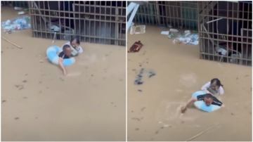 洪水中自救 陆男带救生圈救妻子看哭网友（视频）