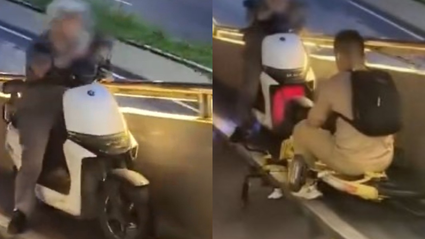 奇葩!深圳两男骑车斗气 雨中僵持互不退让(视频)