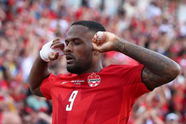 TORONTO, ONTARIO - JUNE 12: Cyle Larin #9 of Canada celebrates scoring his team's first goal during the FIFA World Cup 2026 Group B match between Canada and Bosnia and Herzegovina at Toronto Stadium on June 12, 2026 in Toronto, Ontario.