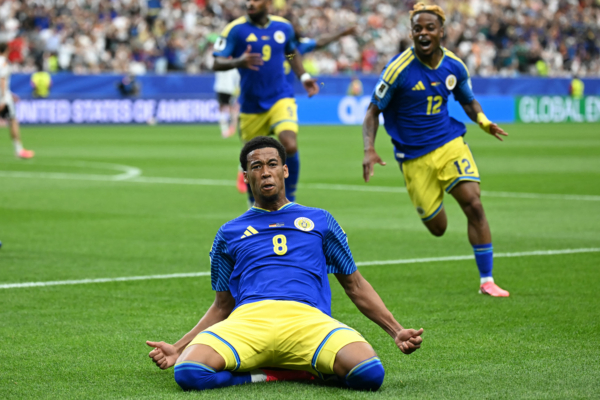 TOPSHOT - Curacao's midfielder #08 Livano Comenencia celebrates after scoring a goal during the 2026 World Cup Group E football match between Germany and Curacao at the Houston Stadium in Houston on June 14, 2026. 