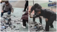 湖南一學校當眾砸毀百部學生手機 引發爭議（視頻）